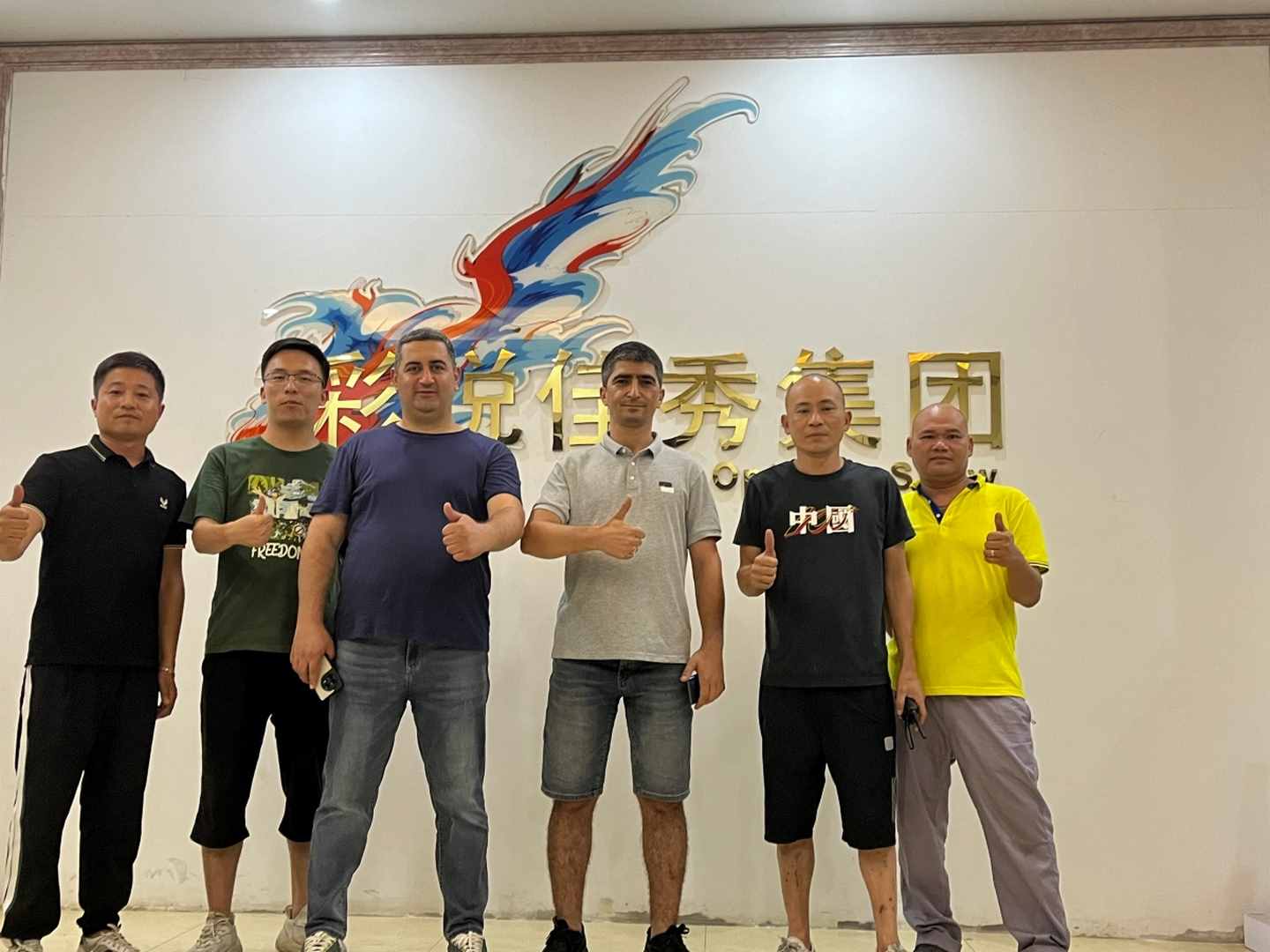 Group of men giving thumbs up